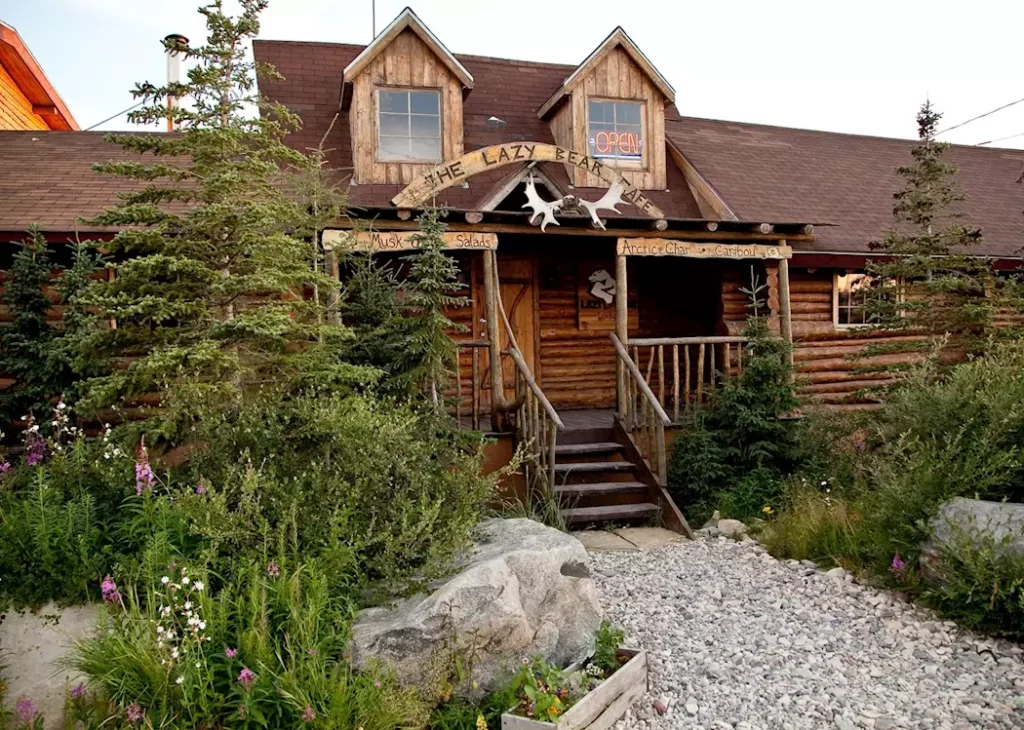 Lazy Bear Lodge, your retreat in Churchill, Manitoba, providing a cozy haven amidst the wild beauty of the Arctic. A central hub for captivating adventures with Polar Bears, Beluga Whales, and the enchanting Northern Lights on your extraordinary journey.