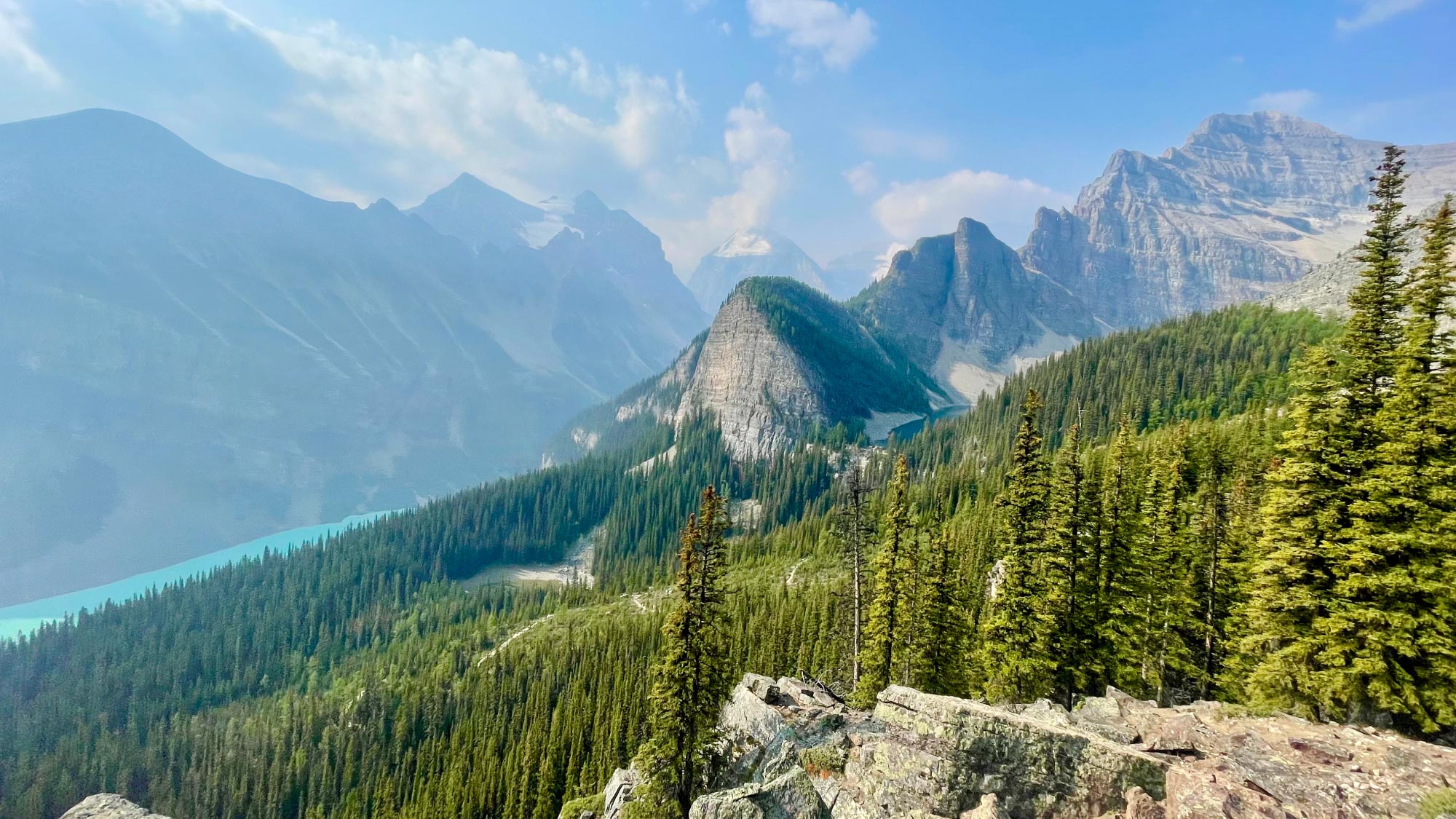 Scenic view of Lake Louise nestled amidst majestic mountains.