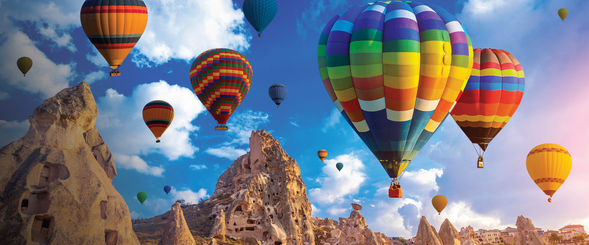 Hot air balloons soaring over Cappadocia, Turkey, captivate self-flying pilots with their own aircraft, offering a breathtaking perspective of Eurasia's stunning landscapes and cultural wonders from the skies above.