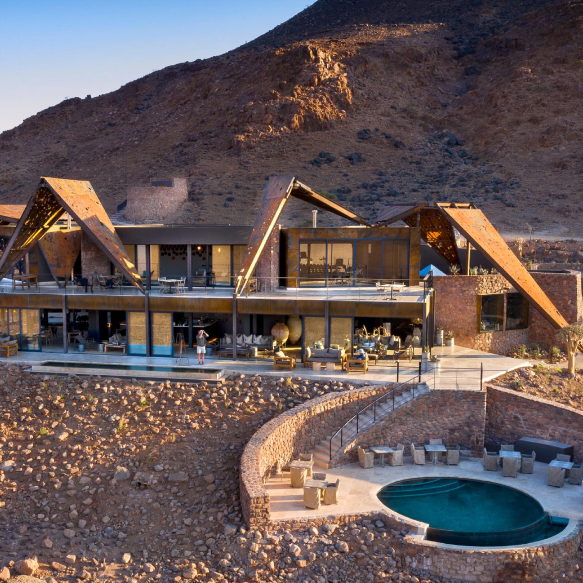 Experience the luxury of Sossusvlei Desert Lodge, nestled in Namibia's Namib Desert. The lodge offers stunning views of the desert landscape and stylish accommodations for a sophisticated desert retreat.
