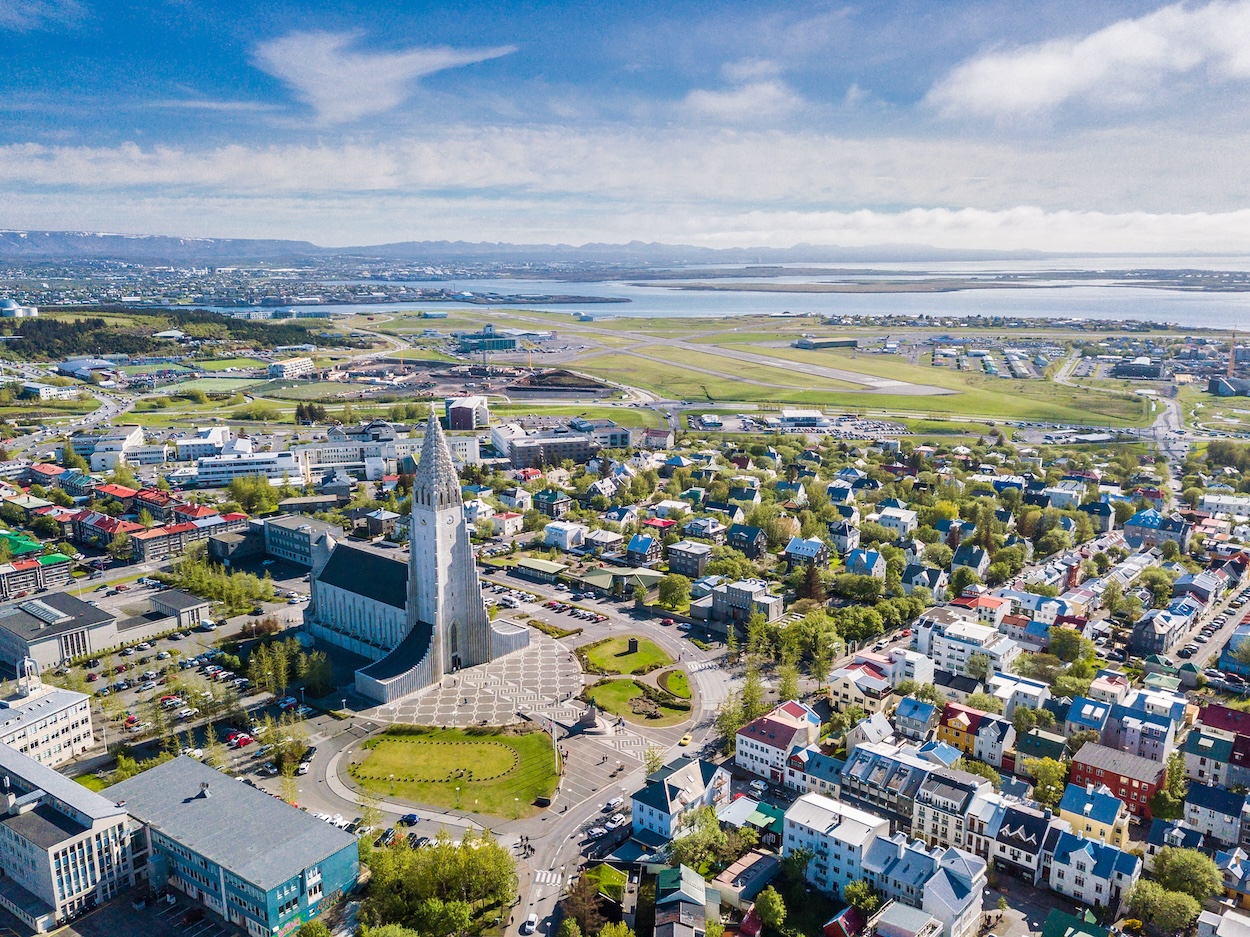 An aerial view of downtown Reykjavik with the Cathedral as the focal point, that can be seen while on a self-fly journey in your own airplane in Iceland