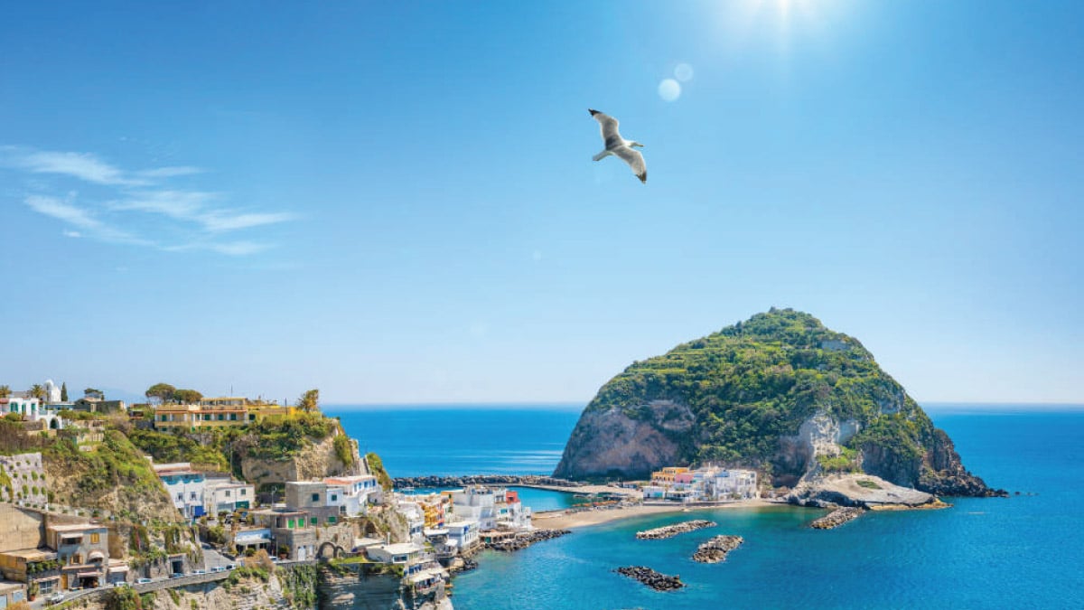 Aerial view of Mont Sant' Angelo in Italy, enticing self-flying pilots with their own aircraft to embark on a European odyssey, promising stunning vistas, cultural exploration, and unforgettable experiences amidst historic landmarks and scenic beauty.