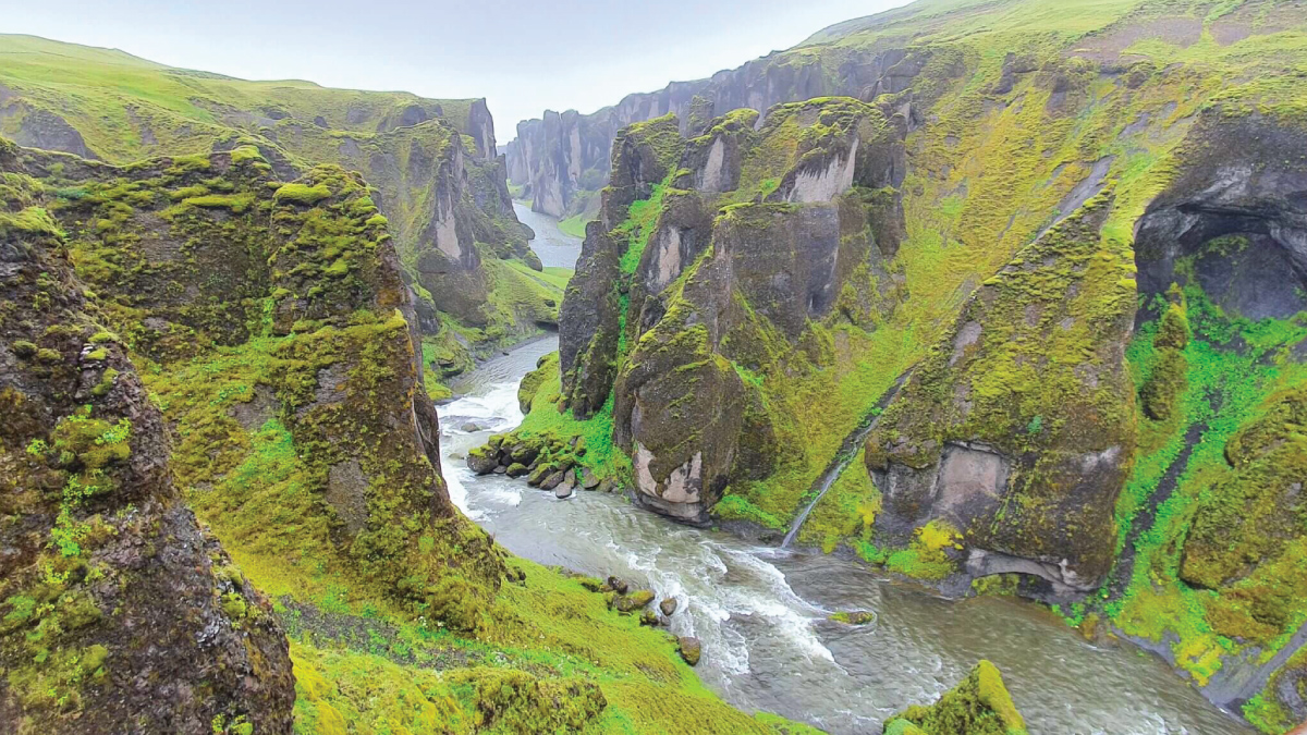 Breathtaking Fjaðrárgljúfur Canyon in Egilsstaðir, Iceland. For self-flying pilots with their own aircraft, this natural wonder beckons, offering a glimpse of Eurasia's diverse landscapes and untamed beauty from above.
