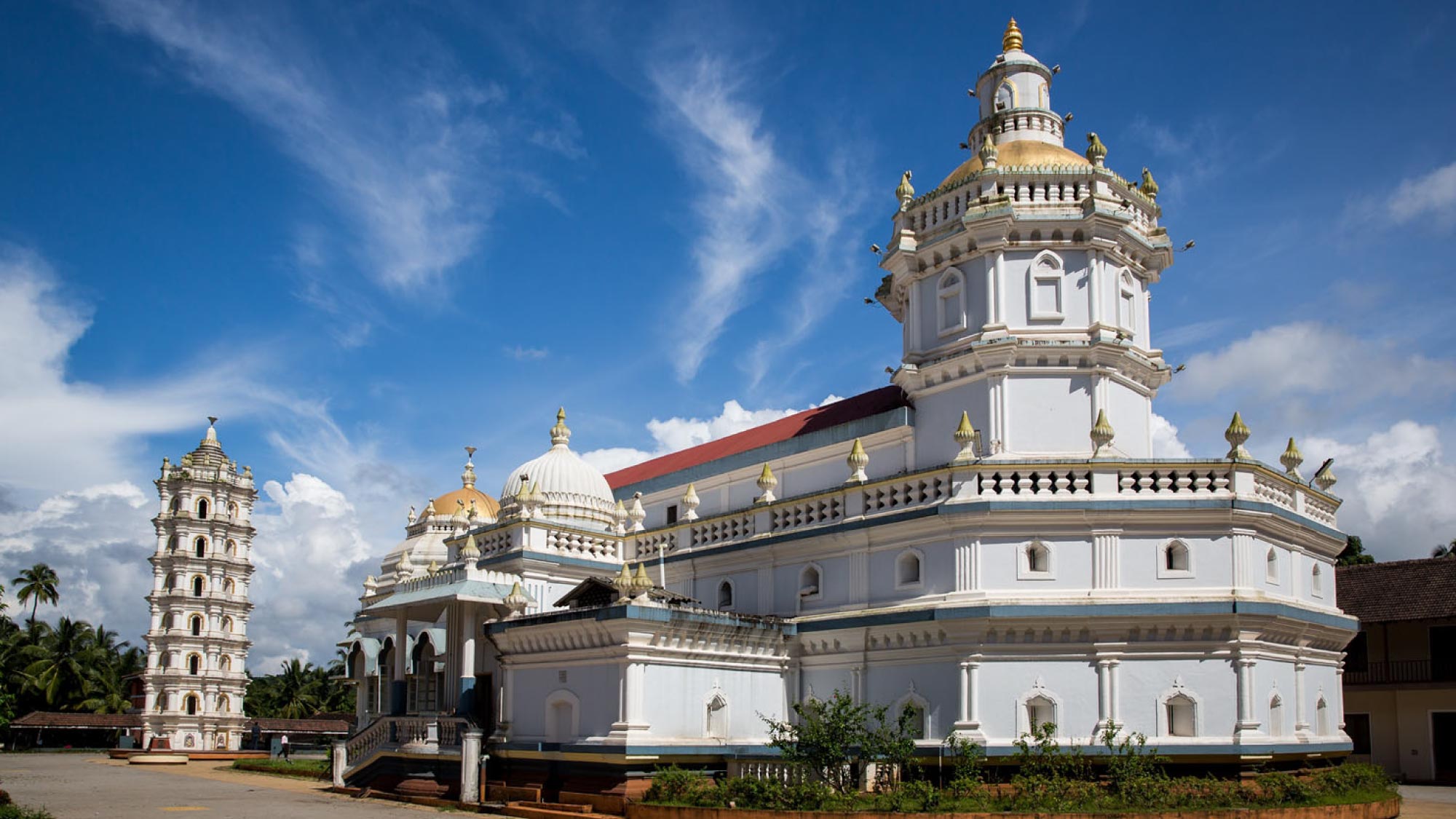 A vibrant image capturing the scenic beauty of Goa, India, featuring palm-fringed beaches, turquoise waters, and colorful architecture. This destination is a highlight of a journey to Australia, visiting 21 countries, ideal for travelers who fly and own their own airplanes.