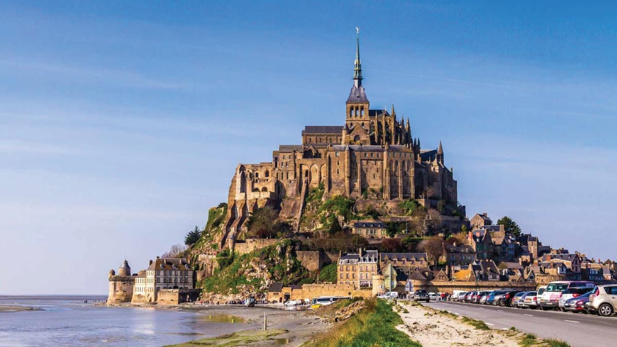 Mont Saint-Michel in Normandy, France, calling out to self-flying pilots with their own aircraft for an unforgettable European adventure.