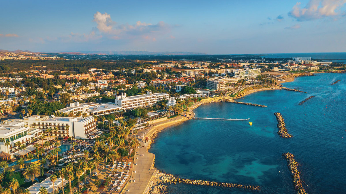 Aerial view of Paphos, Cyprus, captivating self-flying pilots with their own aircraft, beckoning them to embark on a European journey filled with Mediterranean beauty, ancient history, and cultural richness from a bird's-eye perspective.