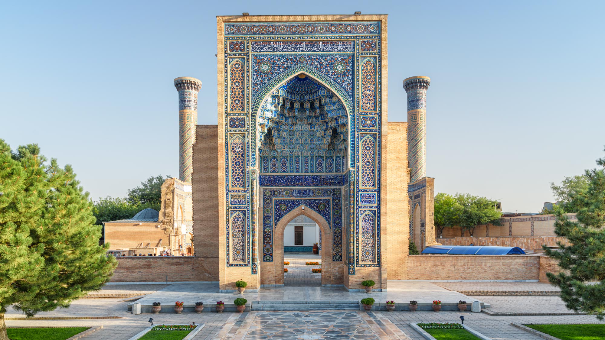 A stunning view of the historic city of Samarkand, Uzbekistan, showcasing its majestic architecture and intricate tilework. Samarkand is a highlight of a journey to Australia, visiting 21 countries, perfect for travelers who fly and own their own airplanes.