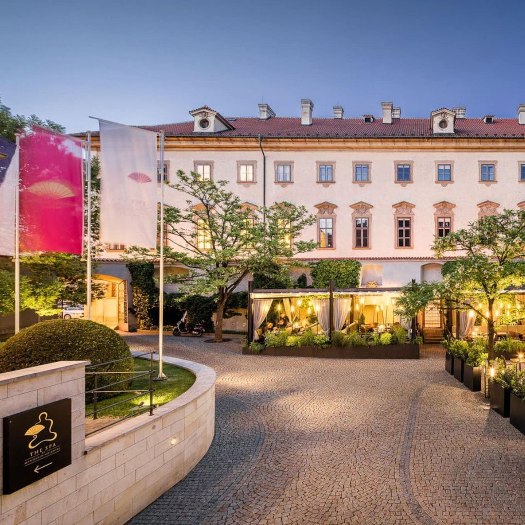A charming view of the outdoor facade of Mandarin Oriental Prague in the Czech Republic. The hotel's architecture exudes elegance against a backdrop of historical charm, inviting guests to experience luxury and sophistication in the heart of Prague.