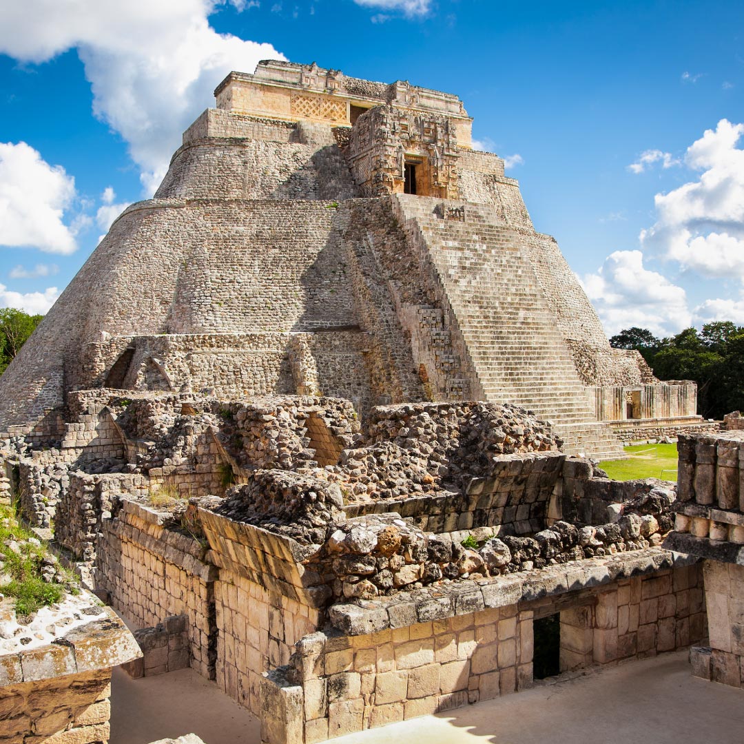 A scenic view of the Pyramids of Uxmal, a historical Mayan archaeological site in Mexico