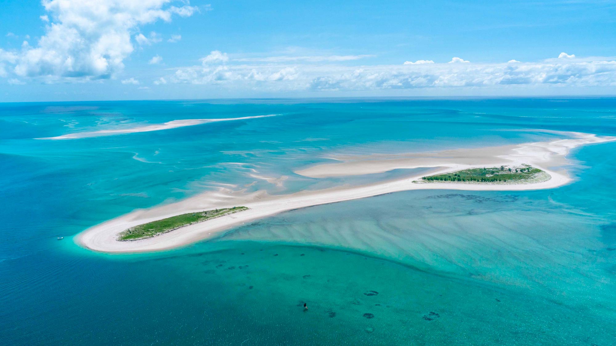 Explore the pristine beauty of Bazaruto Island in Mozambique, featuring crystal-clear waters, white sandy beaches, and lush vegetation, offering an idyllic retreat for relaxation and adventure.