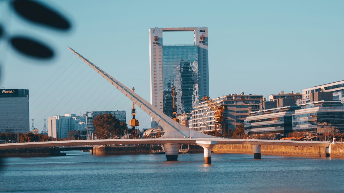 A striking view of Puente de La Mujer (Bridge of the Woman) in Buenos Aires, Argentina, spanning gracefully over the waterway with its unique architectural design. A captivating destination for self-flying pilots exploring South America.