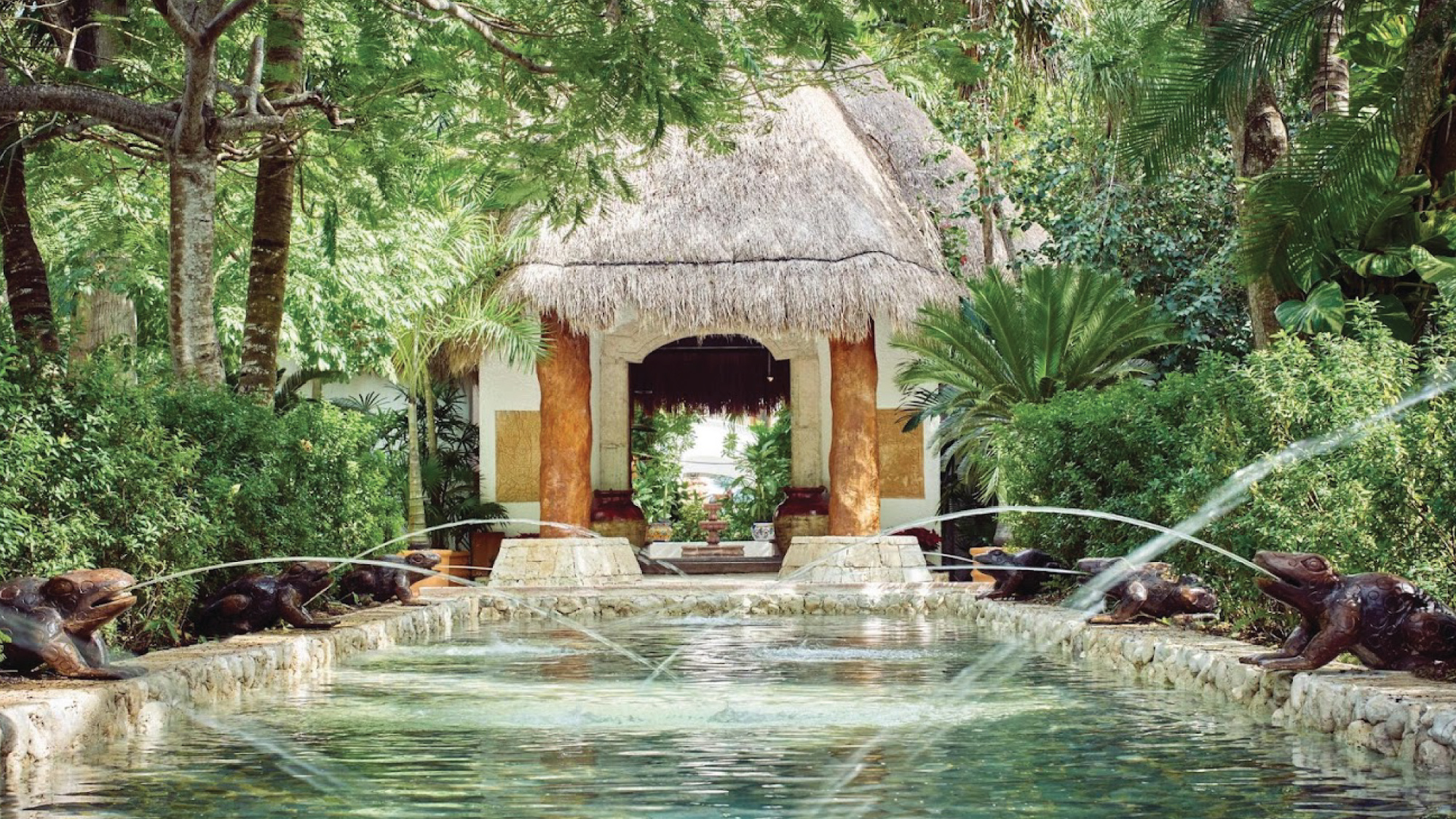 A welcoming view of the entrance to the Belmond Maroma in Cancun, Mexico, showcasing its lush surroundings and inviting atmosphere. Tailored for self-flying pilots