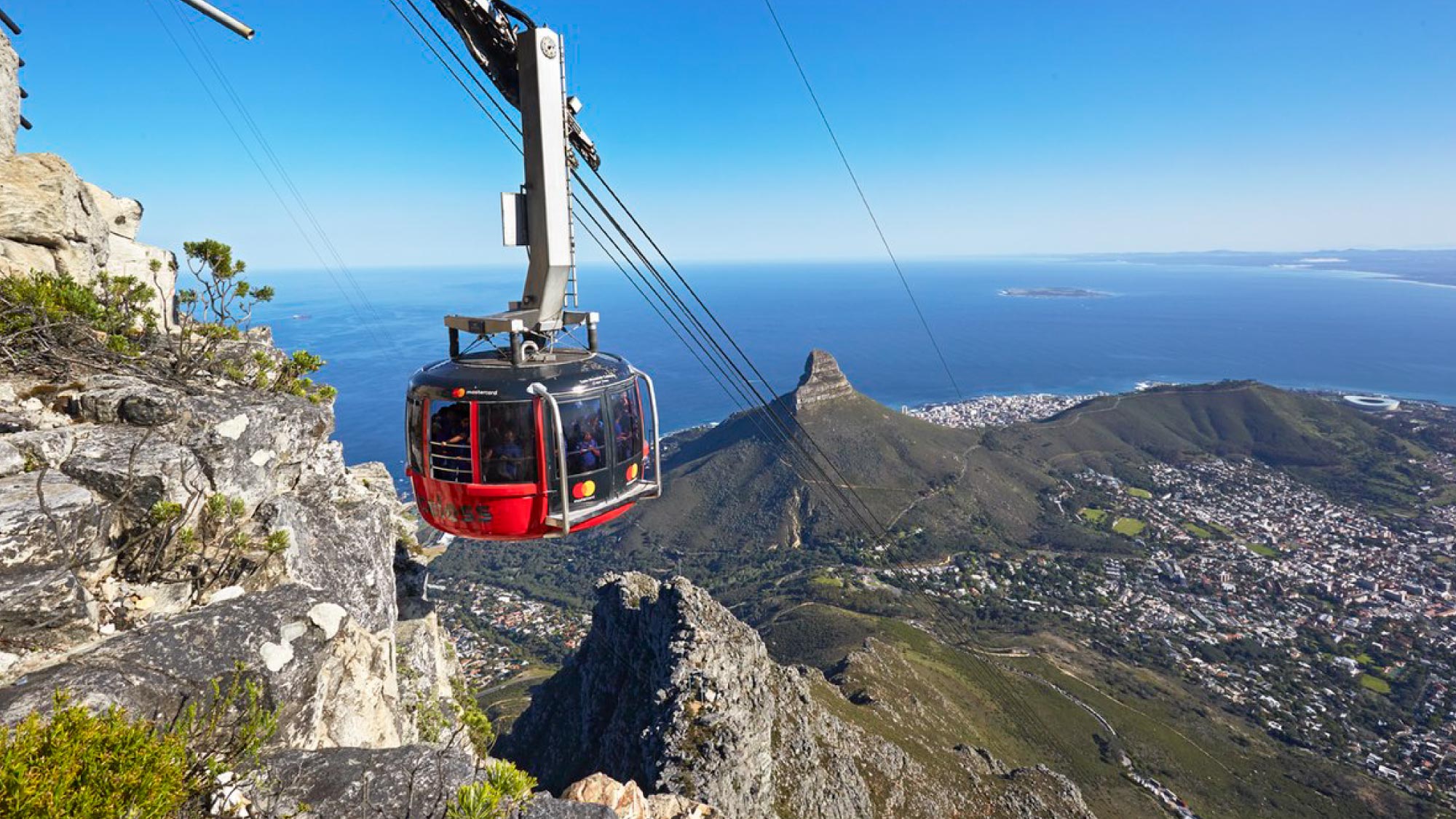 Discover Cape Town from the skies on a pilot's journey, capturing the scenic beauty of the city. Enjoy an encounter with penguins on the beach and take a cable car ride up Table Mountain for stunning vistas.
