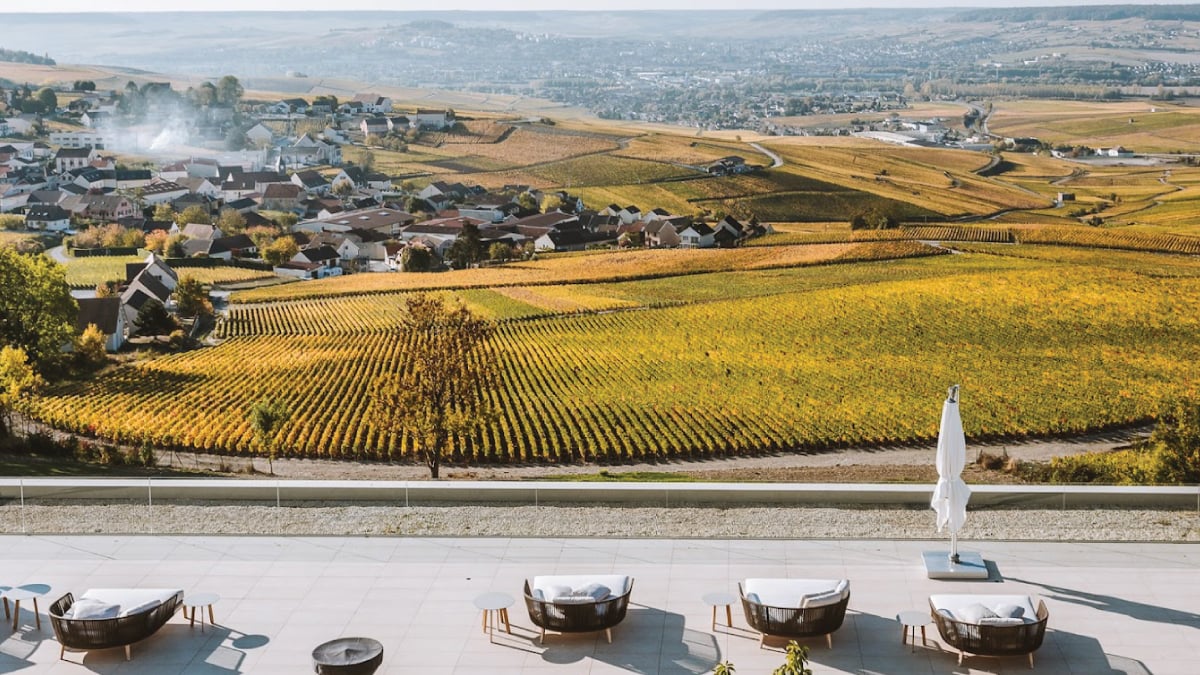 A breathtaking view of the vineyards surrounding the Royal Champagne Hotel & Spa in Champagne, France, offering a serene and picturesque setting. Tailored for self-flying pilots planning a European adventure