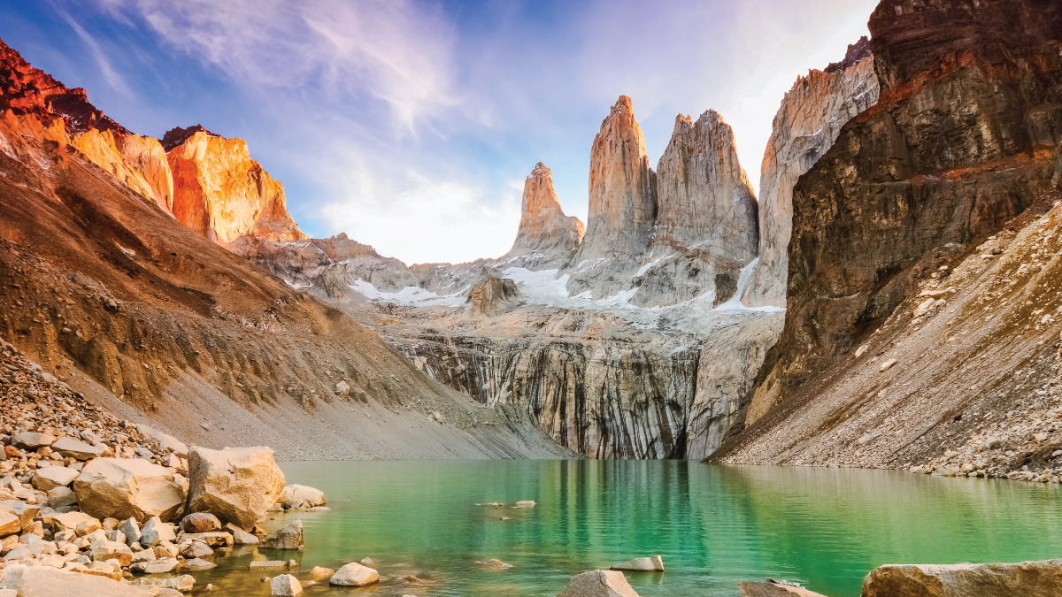 A stunning aerial view of Chilean Patagonia, showcasing rugged mountain peaks, vast glaciers, and pristine lakes. A dream destination for self-flying pilots exploring South America