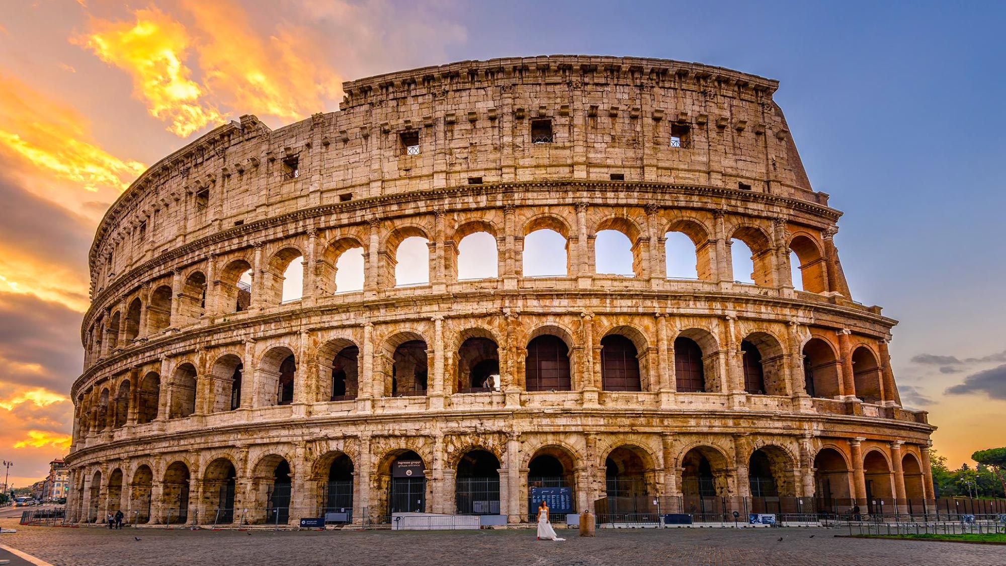 Stunning sunset over the Coliseum in Rome.