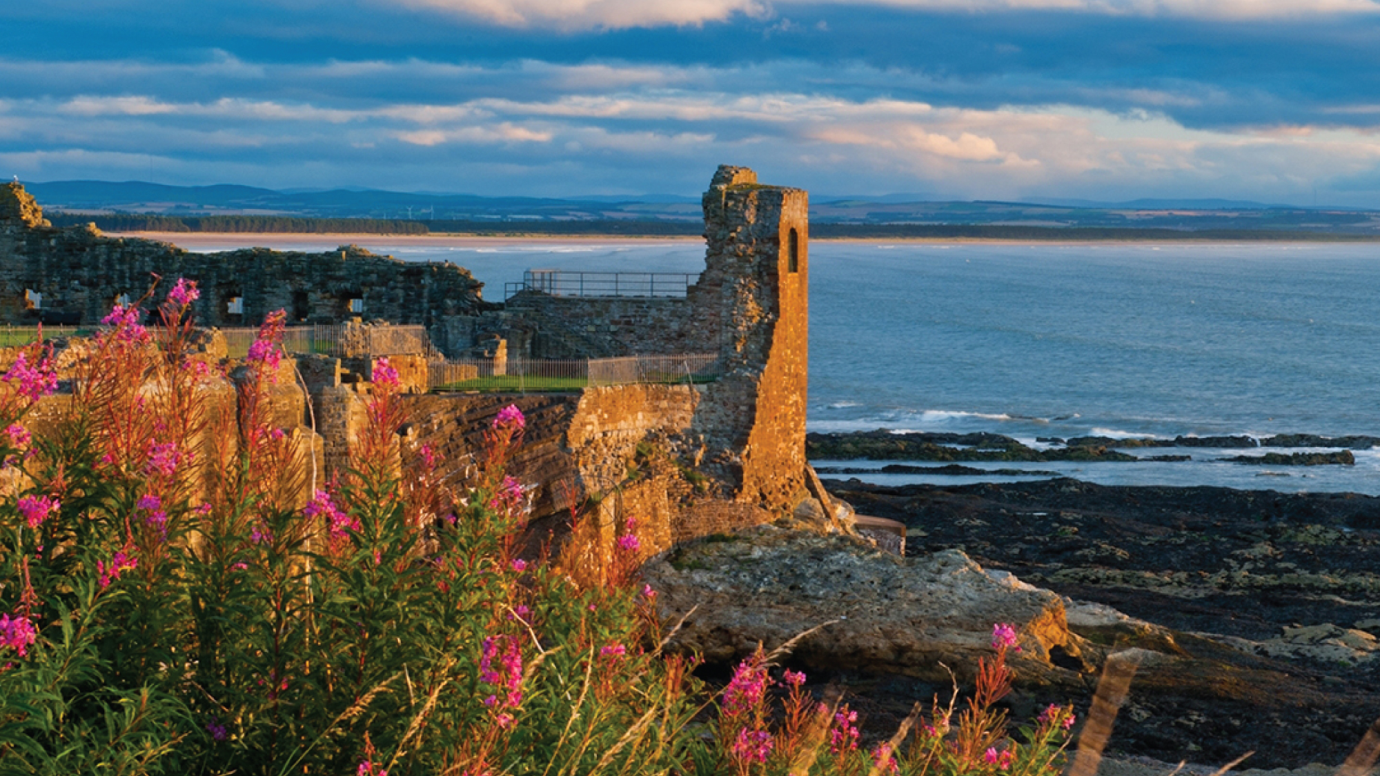 A scenic view of St. Andrews Castle by the sea in the Canadian Maritimes, featuring a historic fortress set against the backdrop of coastal waters. Tailored for self-flying pilots