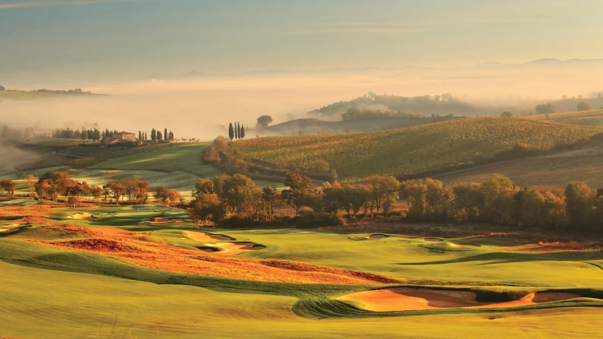 A breathtaking aerial view of the stunning landscape of Tuscany from Rosewood Castiglion Don Bosco, showcasing rolling hills, vineyards, and picturesque villages. Tailored for self-flying pilots planning a European adventure