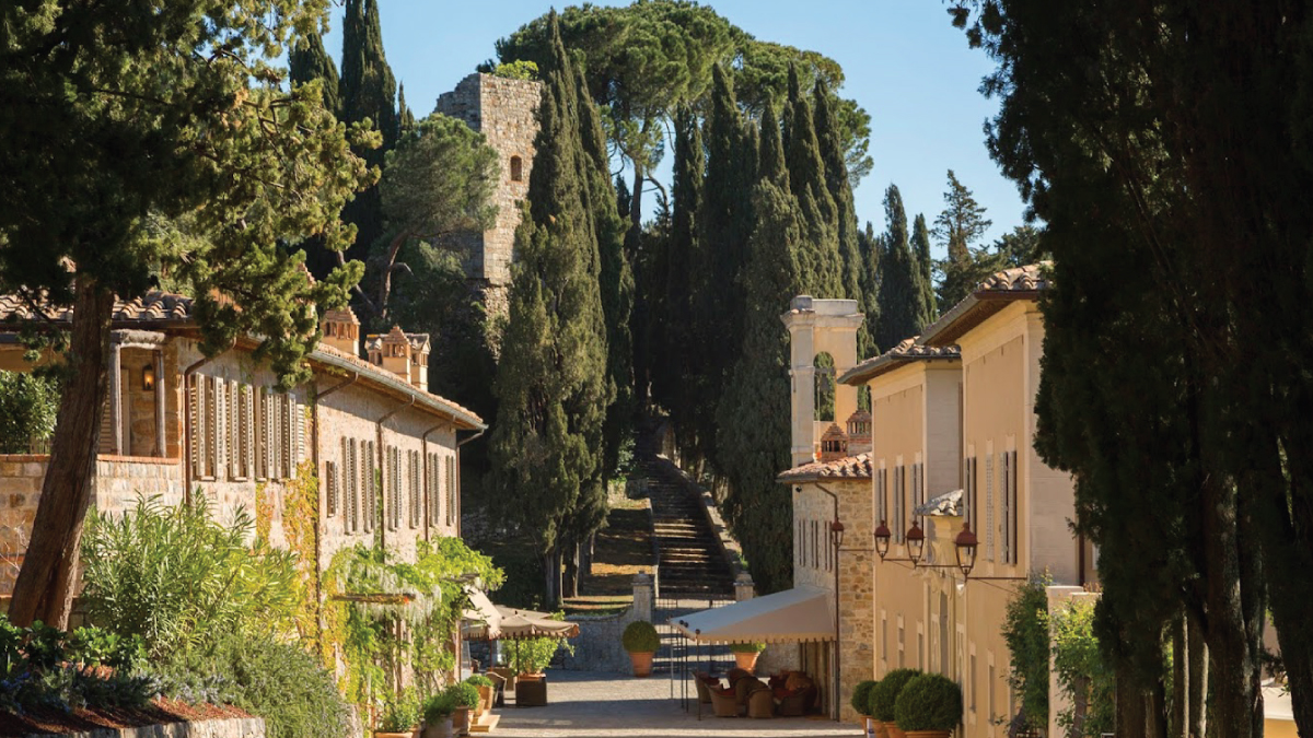 A captivating view of the picturesque hallways in Rosewood Castiglion Don Bosco, adorned with elegant décor and bathed in warm natural light. Tailored for self-flying pilots planning a European adventure