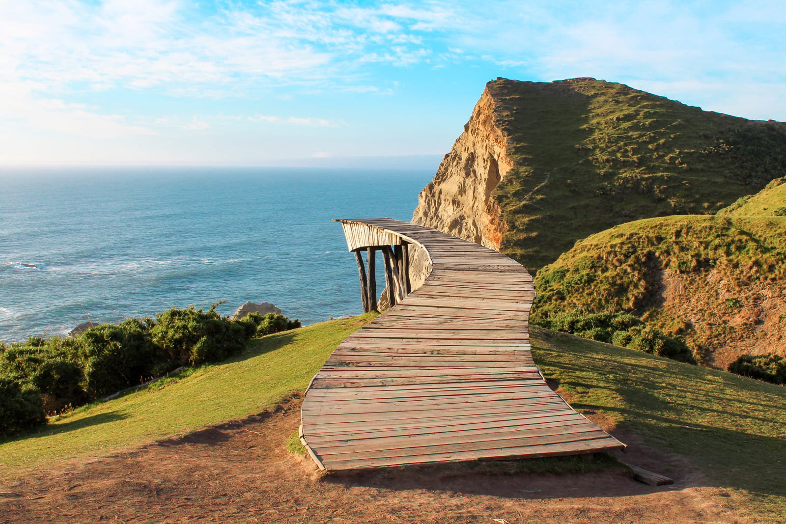 A captivating ocean view from a dock on Chiloe Island, Chile, inviting self-flying pilots to explore the natural beauty of South America