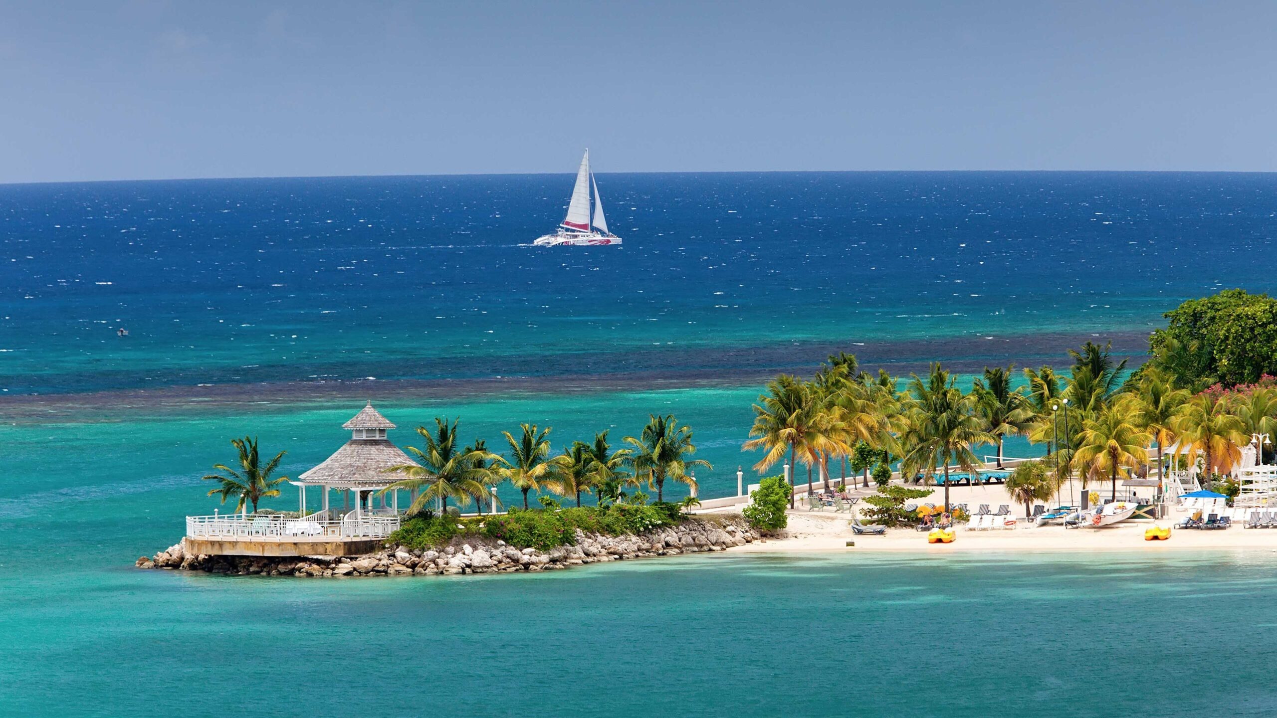 A captivating aerial view of Ocho Rios, Jamaica, with its pristine beaches and lush greenery, beckoning self-flying pilots to explore the enchanting landscapes of the Caribbean.