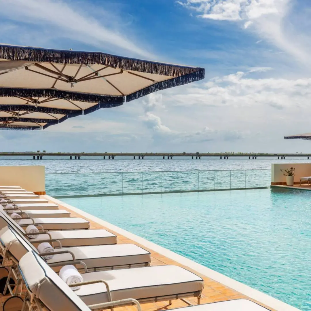 A captivating photograph showcasing the elegant pool at Sofitel Legend Casco Viejo in Panama City.